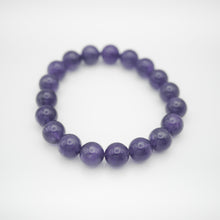 Load image into Gallery viewer, Amethyst Bracelet with beautiful deep purple color. Everyone piece is unique. Best gift for your best friend/ BFF, birthday gift, valantine's day gift and daily wear. 天然紫水晶手鏈, 每一條都是獨一無二深紫色色彩,紫水晶能提升人緣,感壓力及令人平和的力量,最佳的節日禮物,閨蜜禮物,生日及情人節禮物。彈力線設計,可調節長度,簡單易佩搭,適合經常配戴。