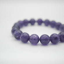 Load image into Gallery viewer, Amethyst Bracelet with beautiful deep purple color. Everyone piece is unique. Best gift for your best friend/ BFF, birthday gift, valantine's day gift and daily wear. 天然紫水晶手鏈, 每一條都是獨一無二深紫色色彩,紫水晶能提升人緣,感壓力及令人平和的力量,最佳的節日禮物,閨蜜禮物,生日及情人節禮物。彈力線設計,可調節長度,簡單易佩搭,適合經常配戴。