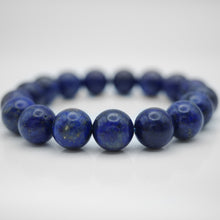 Load image into Gallery viewer, Natural Lapis Bracelet with beautiful deep blue color &amp; gold foiled. Everyone piece is unique. Best gift for your best friend/ BFF, birthday gift, valantine&#39;s day gift and daily wear. 天然青金石手鏈， 每一條都是獨一無二深藍色彩配金片，青金石能提升財富運及人緣，減壓力及令人平和的力量，最佳的節日禮物，閨蜜禮物，生日及情人節禮物。彈力線設計，可調節長度，簡單高貴又易佩搭，適合經常配戴。
