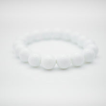 Load image into Gallery viewer, Tridacna stone bracelet natural crystal stone. Special gift, blessing gift,birthday gift,daily wear,for everyone. 硨磲手鏈， 硨磲石保有平安功效，提升智慧，告白禮物，母親節禮物，純淨簡單好搭配，適合天天配戴。彈力線設計，可調節長度，簡單易佩搭，適合經常配戴。
